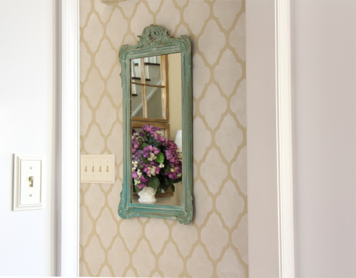 Stenciled wall with mirror