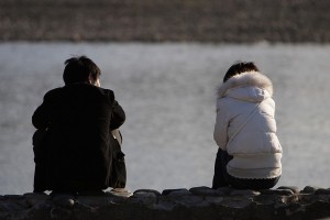 Couple sitting apart