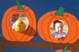 Two kids in Pumpkin Cutouts