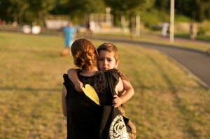 Mom holding a sad boy