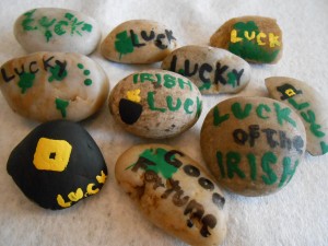 Rocks painted with St. Patrick's day words and symbols